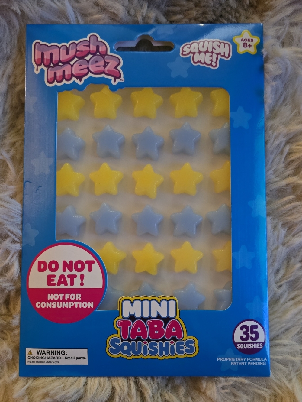 Mush Meez Mini Taba Squishies 35 yellow and blue star-shaped squishy
